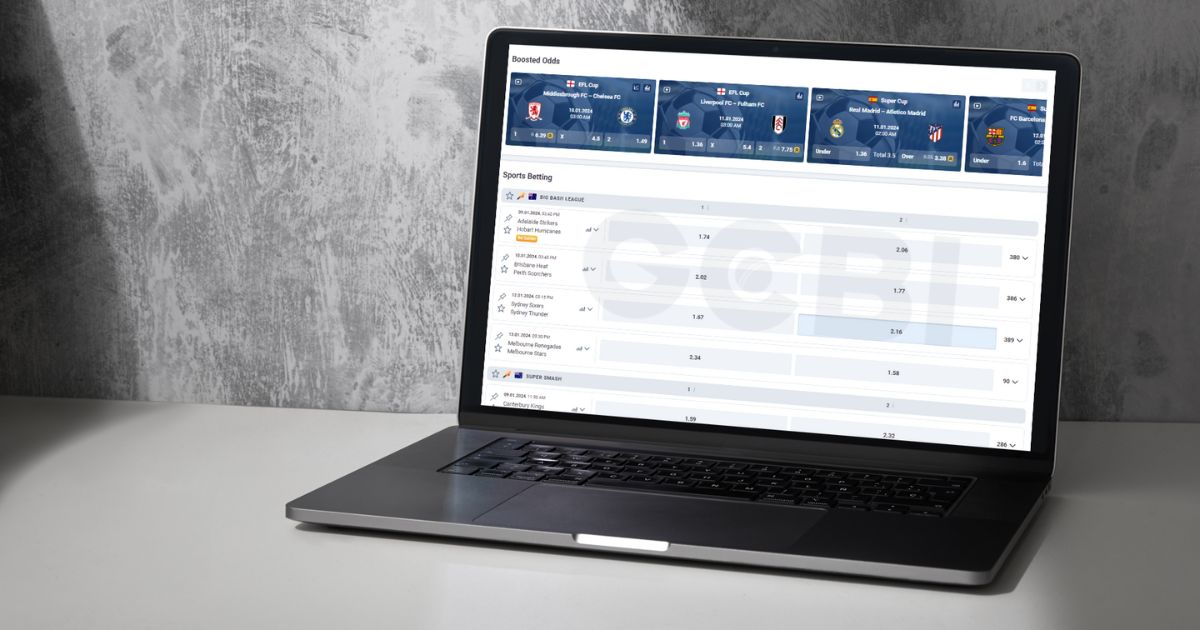 a laptop screen shows cricket betting odds
